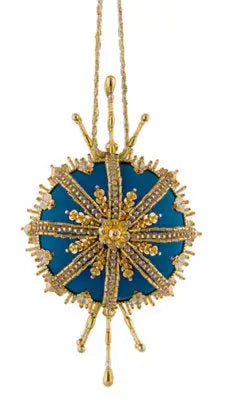 Teal and gold ornate Christmas ornament from Cracker Box for a White Christmas celebration