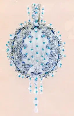 Ornate white and blue beaded Christmas ornament from Cracker Box Golden Oldie kit