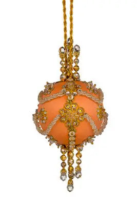 Ornate peach-colored Christmas ornament with gold accents and jewels from Cracker Box Heir Apparent kit