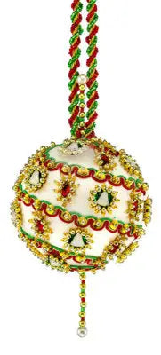 White spherical Christmas ornament with red, green, and gold embellishments from Cracker Box Christmas ornament kit