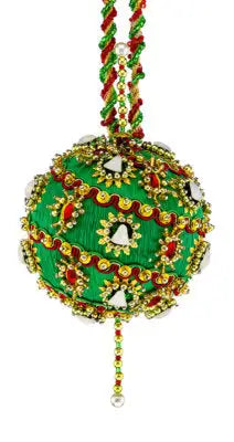 Ornate green Christmas ornament with red, gold, and white embellishments from Cracker Box Christmas ornament kit