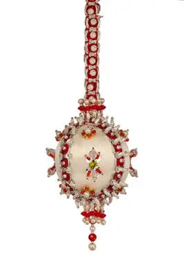 Ornate white Christmas ornament with red and pearl beads from Cracker Box Holiday Festival kit
