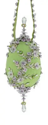 Ornate green celery egg Christmas ornament with floral beading and crystal accents from Cracker Box