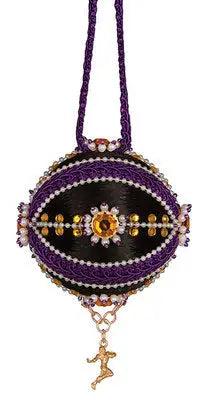Intricately decorated black and purple ornament with beaded accents and a gold dancer charm, perfect for Cracker Box ornament kits with unique trims