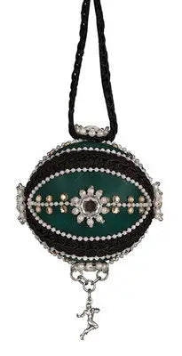 Dark green and black beaded egg-shaped ornament with silver figurine from Cracker Box ornament kits