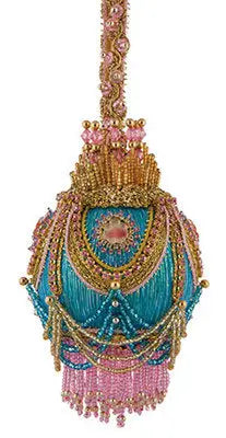 Ornament kit featuring an ornate teal beaded Christmas ornament with gold accents and tassel fringe