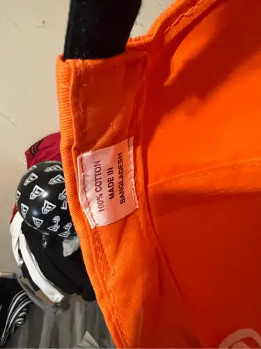 Orange Tide Racing Ricky Rudd hat with 100 Cotton Made in Bangladesh tag