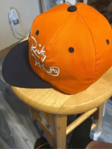 Orange Tide Racing Ricky Rudd hat with black brim and white embroidered lettering
