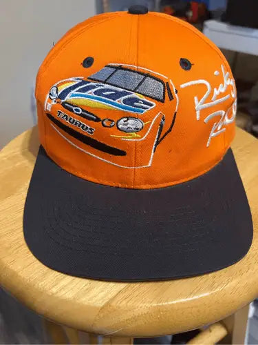 Orange and black Tide Racing Ricky Rudd hat with embroidered race car design
