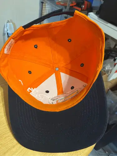 Orange and black Tide Racing Ricky Rudd hat with flat brim baseball cap