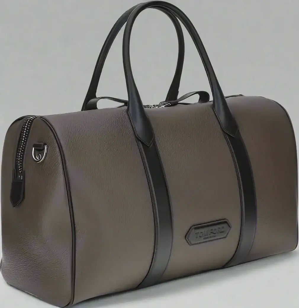 Sophisticated gray travel bag with black straps and handles from Tom Ford Men’s collection