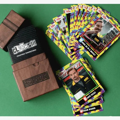 Colorful trading cards from Topps 2022 Clerks III set next to leather card holders