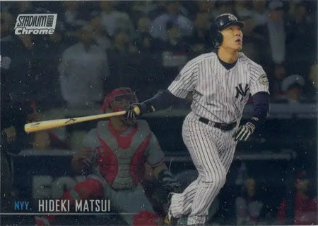 Baseball player in New York Yankees uniform swinging bat on Topps insert card