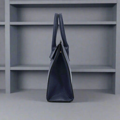 Navy synthetic leather handbag with two top handles and fold-over flap closure
