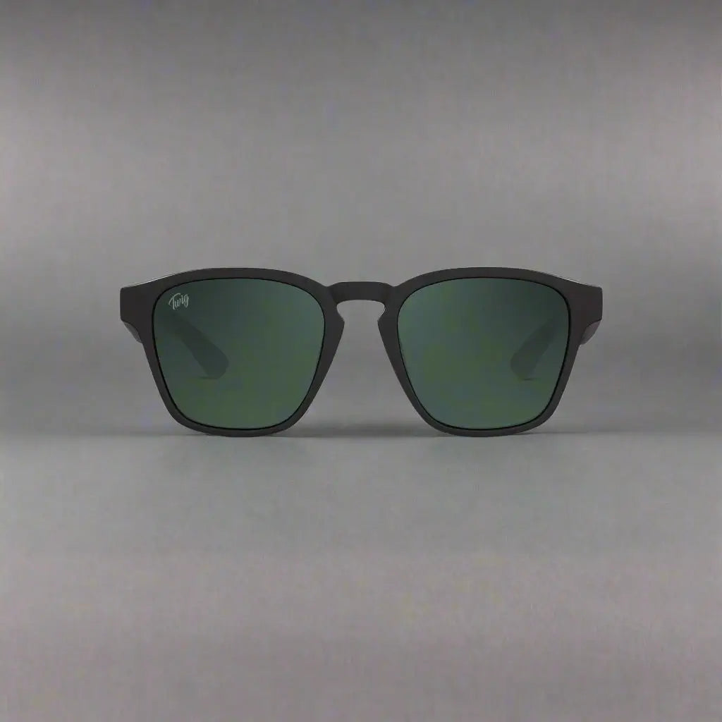 Matte black square-frame sunglasses with green tinted lenses from Twig Unisex UV3 collection