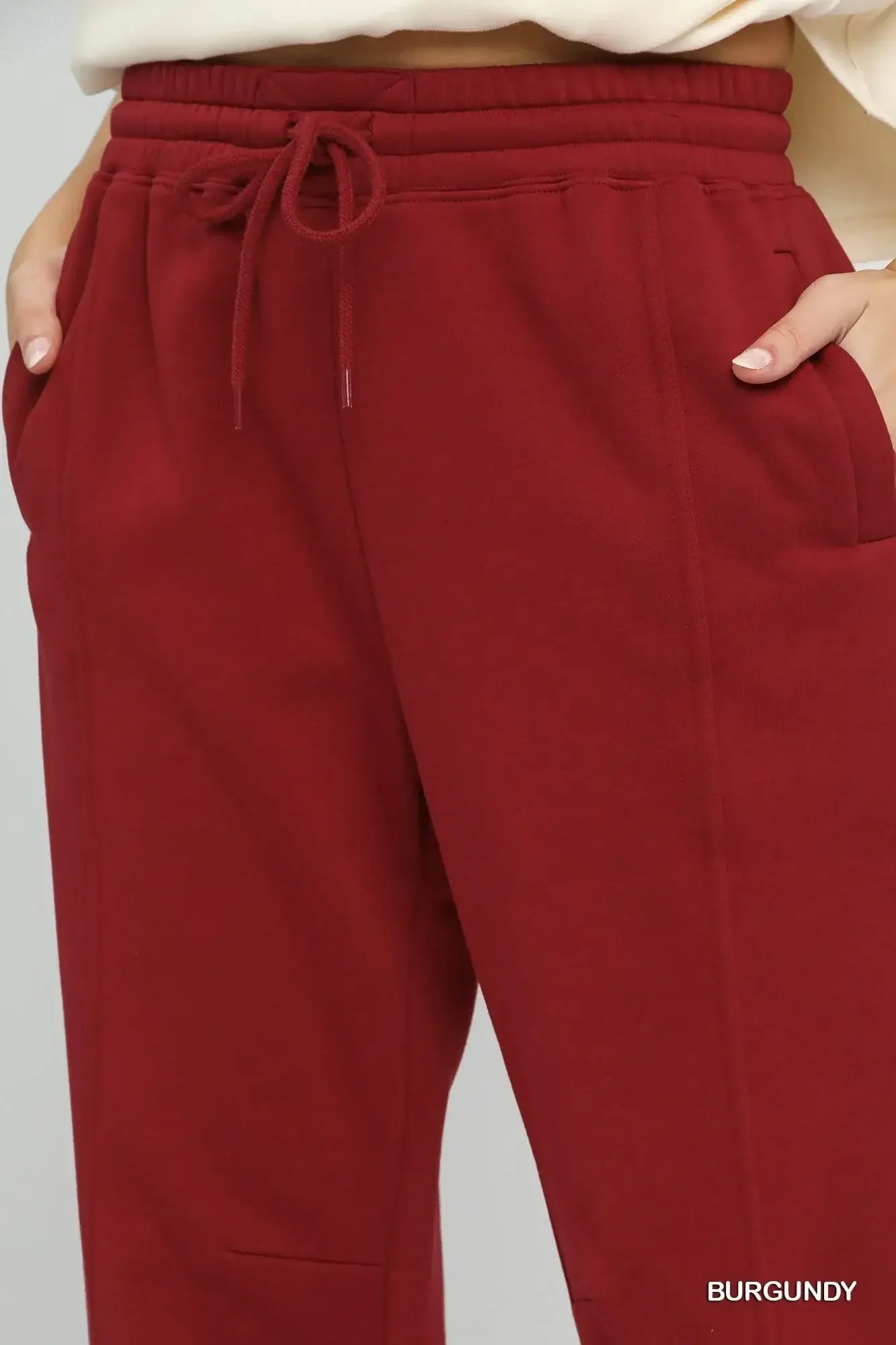 Umgee fleece jogger pants with drawstring waist, pockets, and elastic hem