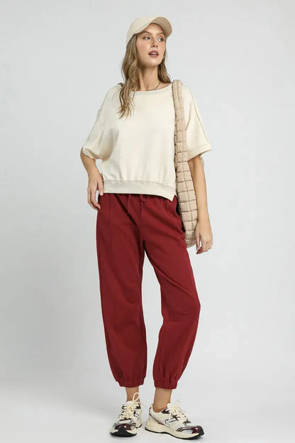 Cream-colored oversized sweatshirt with puff sleeves paired with Umgee fleece jogger pants