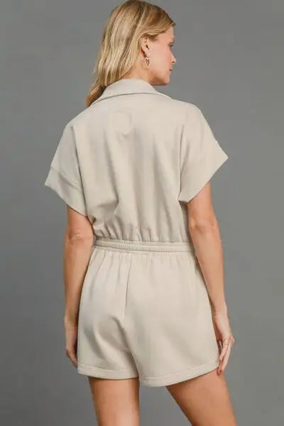 Woman wearing tan full size dolman sleeved romper with elastic waist
