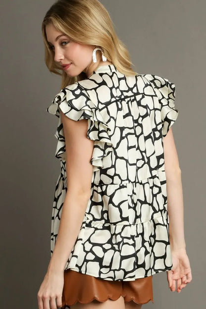 Umgee Full Size Two Tone Animal Print Notched Ruffle Cap Sleeve Blouse Plus Size