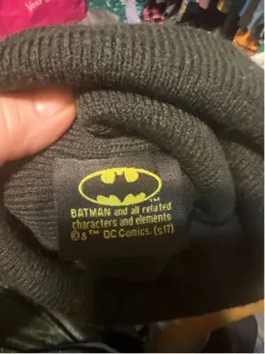 Black knit beanie with yellow Batman logo, perfect for Harley Quinn fans