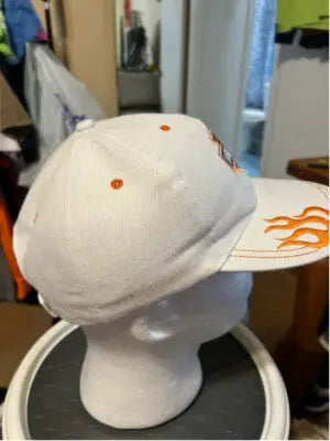 White unisex Harley-Davidson hat with orange flame embroidery on the brim