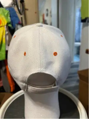 White baseball cap with orange eyelets from Unisex Harley-Davidson Hat One Size Collection