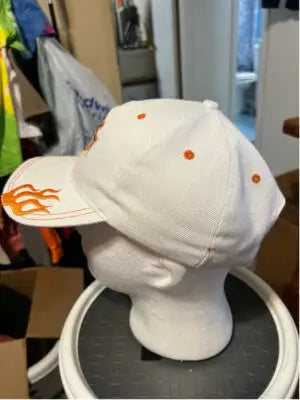 White unisex Harley-Davidson hat with orange flame embroidery and eyelets