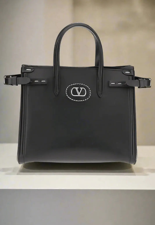Black leather Antibes handbag with top handles and silver V-logo emblem