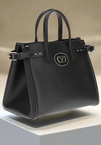 Valentino Garavani Black Antibes Handbag with leather tote, top handles, and side buckles