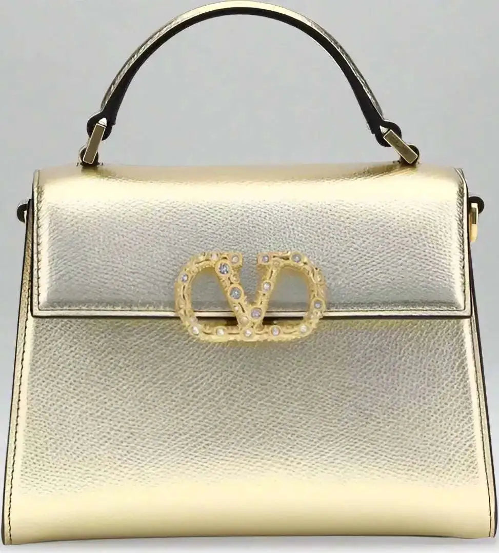Valentino Garavani metallic garnet mini handbag with top handle and crystal V-logo clasp