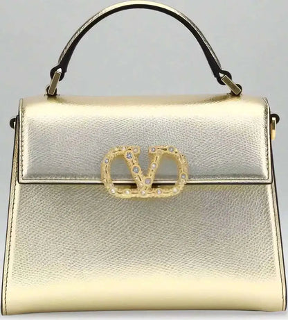 Valentino Garavani metallic garnet mini handbag with top handle and crystal V-logo clasp