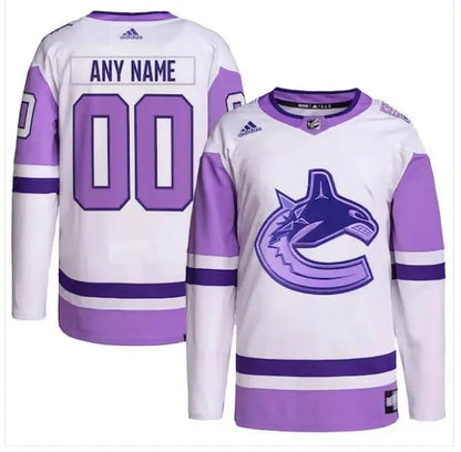 White and purple Vancouver Canucks hockey jersey with orca logo for Adidas Fights Cancer