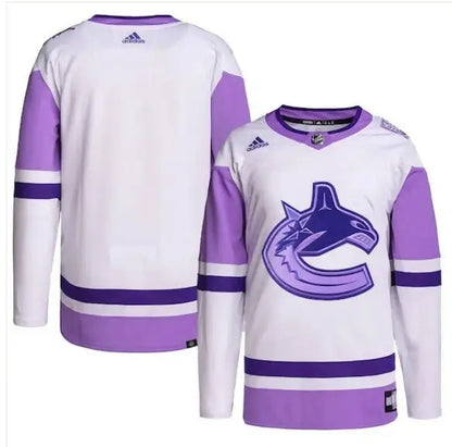 White and purple Vancouver Canucks hockey jerseys with logo for adidas Hockey Fights Cancer