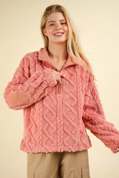 Pink cable knit sherpa jacket with a half zip and fuzzy fleece half design