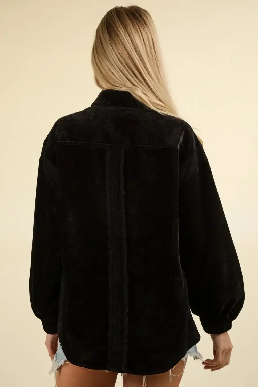 Black oversized velvet shacket with raw hem and mixed media button-down closure