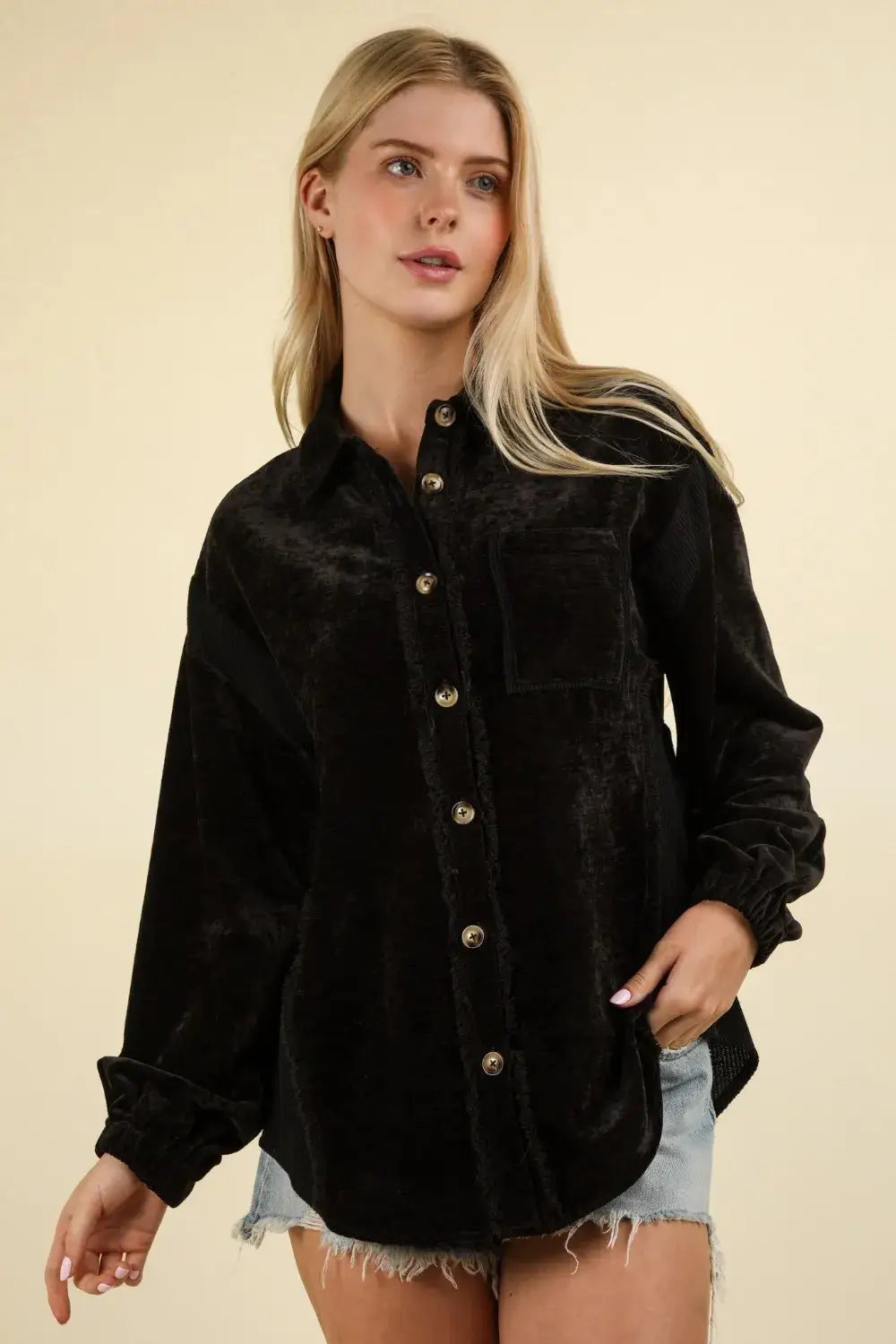 Black velvet mixed media button down shacket with raw hem, styled with frayed denim shorts