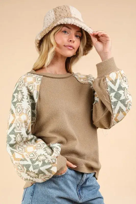 Beige and white Aztec patterned printed long sleeve round neck knit top with textured design