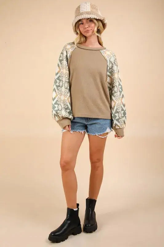 Snake print bomber jacket with metallic accents and distressed denim shorts for a stylish long sleeve round look