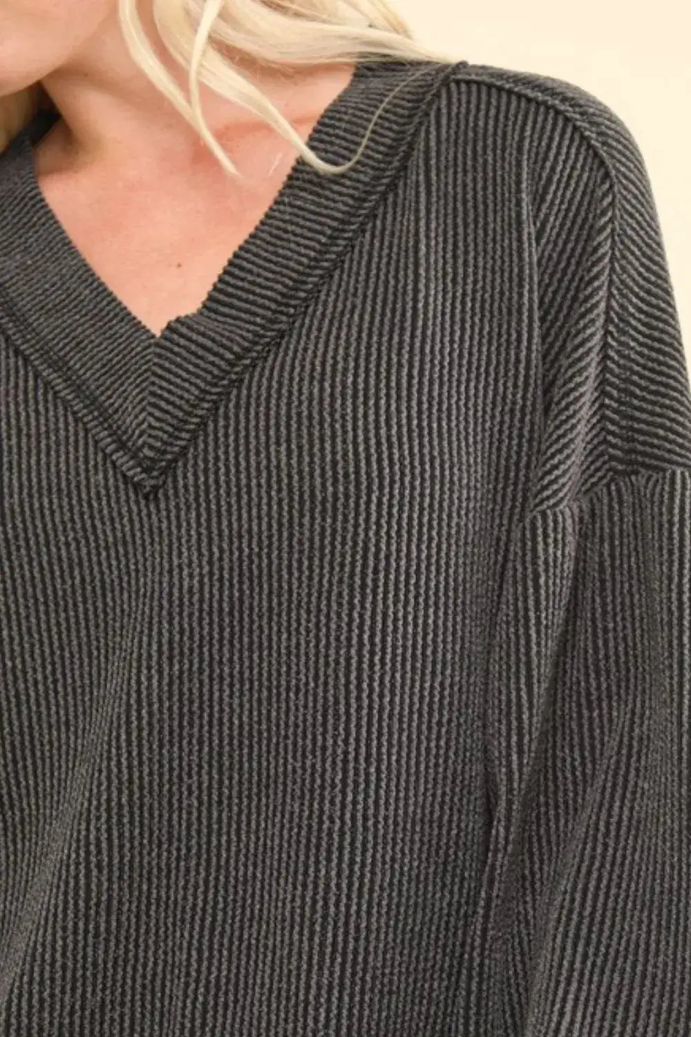 Charcoal two tone ribbed V-neck sweater with exposed seams and relaxed fit