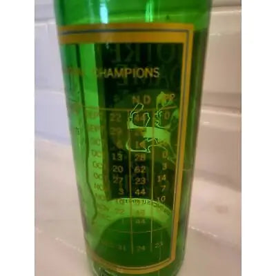 Green glass with gold lettering of the Notre Dame Fighting Irish commemorative bottle