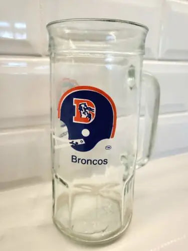Vintage 1980’s Denver Broncos NFL glass mug featuring the Broncos logo