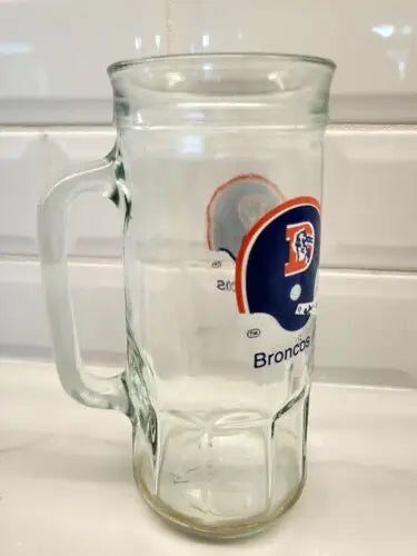 Clear glass Denver Broncos mug from Vintage 1980s NFL Fisher Peanuts collection