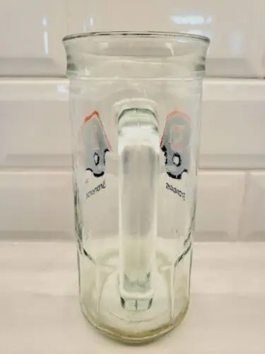 Clear glass beer mug featuring cartoon ghosts and Denver Broncos NFL logo design