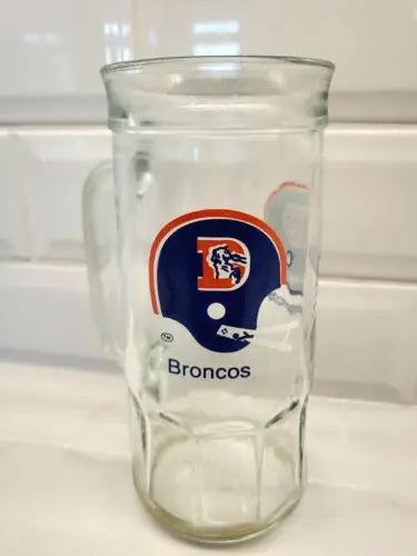 Vintage 1980s Denver Broncos NFL glass mug featuring Fisher Peanuts design