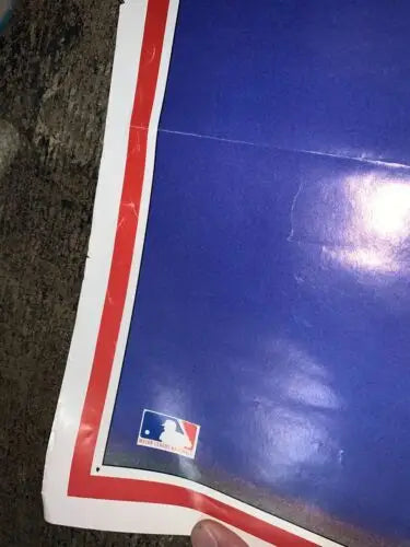 Blue poster with red and white border featuring Sports Illustrated Ozzie Smith