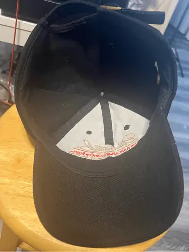 Black baseball cap with white interior paneling from Vintage Dale Earnhardt 7 Time Champion Hat