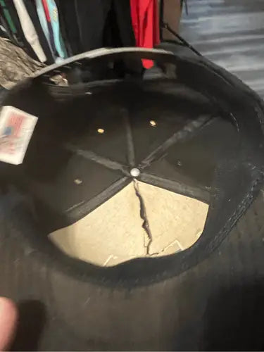 Inside view of vintage Freeport Sulphur snapback hat with cracked brim insert
