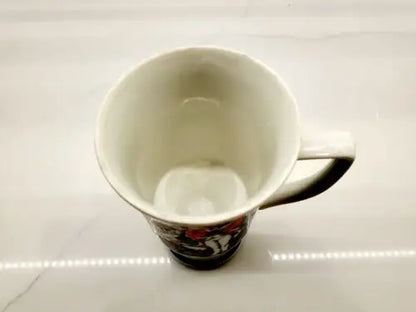 Empty ceramic mug with handle featuring Red Coats Revolutionary War design