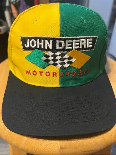 Yellow and green John Deere Motor Sports snapback hat with black brim for motorsports fans