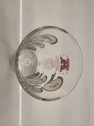 Clear glass featuring apple and letter design from Vintage NFL American Football Conference Eatern Division Helmut Logo Glass